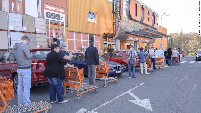 People wait in line to enter a reopened shop in the city of Havirov, in the Czech Republic, on Thursday.