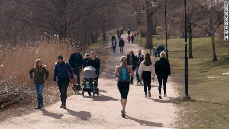 People run and walk in Nacka, in the outskirts of Stockholm, Sweden, Wednesday, April 8, 2020. Swedish authorities have advised the public to practice social distancing because of the coronavirus pandemic, but still allow a large amount of personal freedom, unlike most other European countries. (AP Photo/Andres Kudacki)