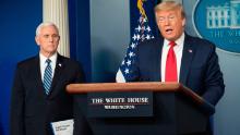 US Vice President Mike Pence listens as US President Donald Trump speaks during the daily briefing on the novel coronavirus, which causes COVID-19, in the Brady Briefing Room at the White House on April 9, 2020, in Washington, DC.