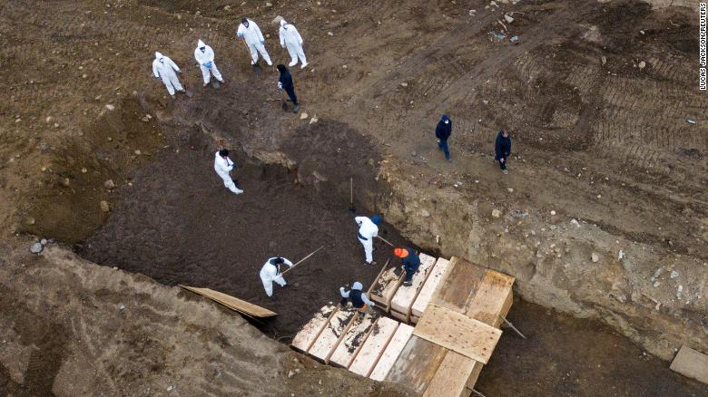 Drone pictures show bodies being buried on New York&#39;s Hart Island where the Department of Corrections is dealing with more burials amid the coronavirus pandemic.