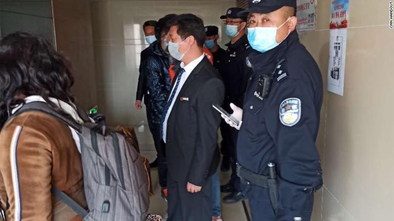 Police come to the house of an African resident in Beijing.