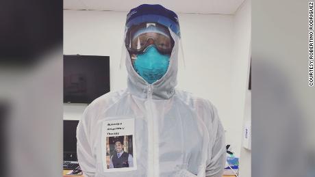 Robertino Rodriguez, a respiratory therapist, put a laminated photo of his face along with his name on his PPE gear -- an effort to put his patients at ease. The idea has caught on.