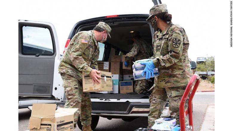 Arizona National Guard soldiers load PPE into a van destined for Shiprock, New Mexico, on Navajo Nation land.