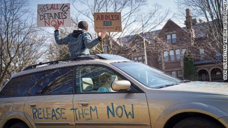 Activists who stayed mostly in their cars for social distancing honked horns outside the Governor's Residence in St. Paul, Minnesota, on March 27.