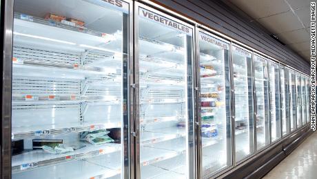 Empty store shelves are seen in a supermarket as people has been stocking up for food and other essential items fearing the supply shortages.