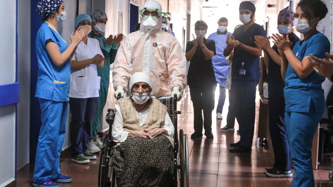 Medical workers in Istanbul clap for 107-year-old Havahan Karadeniz as she is discharged from the hospital on April 13, 2020. She had just recovered from the coronavirus.