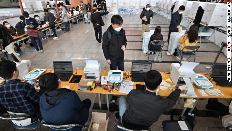 South Koreans cast their ballot during early voting at a polling station in Seoul on April 10, 2020, ahead of next week&#39;s parliamentary elections. - South Koreans can cast their ballots for the upcoming April 15 parliamentary elections during the two-day early voting period until April 11. (Photo by Jung Yeon-je / AFP) (Photo by JUNG YEON-JE/AFP via Getty Images)