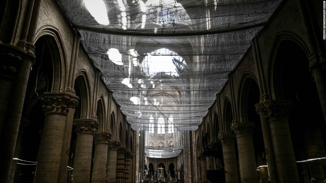 A protective net is seen installed at Notre Dame de Paris Cathedral during preliminary work on May 15, 2019, one month after the fire.