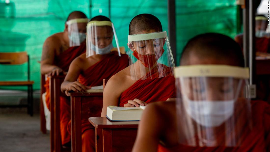 Novice Buddhist monks wear face shields at the Molilokayaram Educational Institute in Bangkok, Thailand, on April 15, 2020.