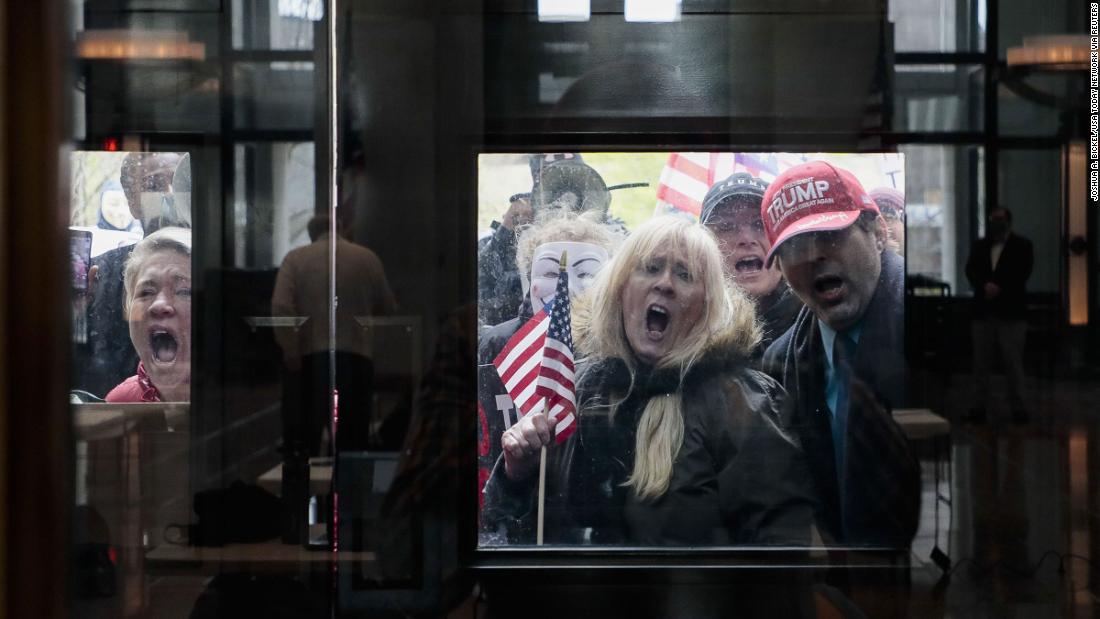 Protesters stand outside the Statehouse Atrium in Columbus, Ohio, &lt;a href=&quot;https://www.cnn.com/2020/04/16/us/protests-coronavirus-stay-home-orders/index.html&quot; target=&quot;_blank&quot;&gt;to voice their opposition to stay-at-home orders.&lt;/a&gt; About 100 protesters assembled outside the building during Gov. Mike DeWine&#39;s weekday update on the state&#39;s response to the pandemic.