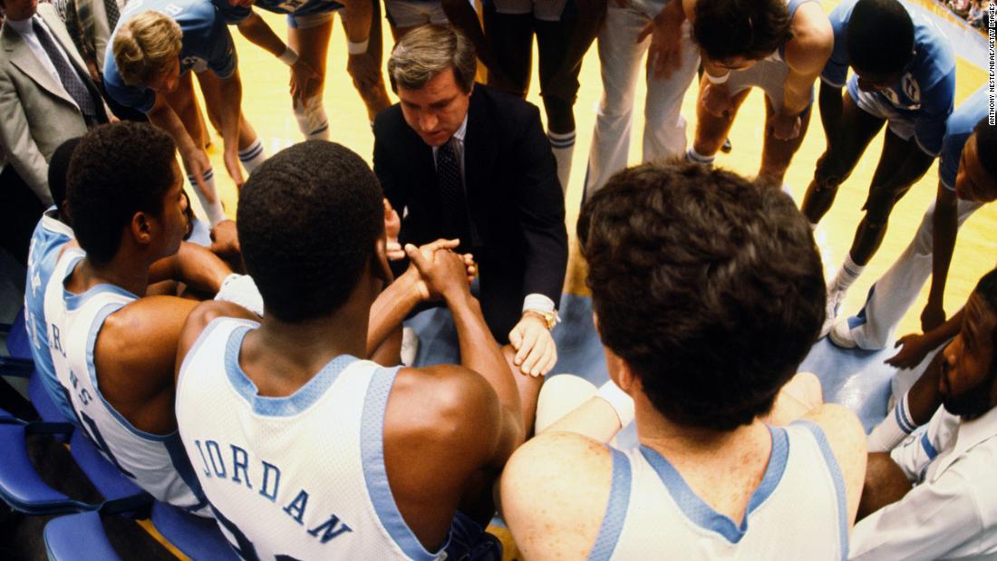 North Carolina players huddle around head coach Dean Smith during a game against Clemson. Jordan was named ACC Freshman of the Year in 1982, but his most memorable contribution came during the NCAA Tournament.