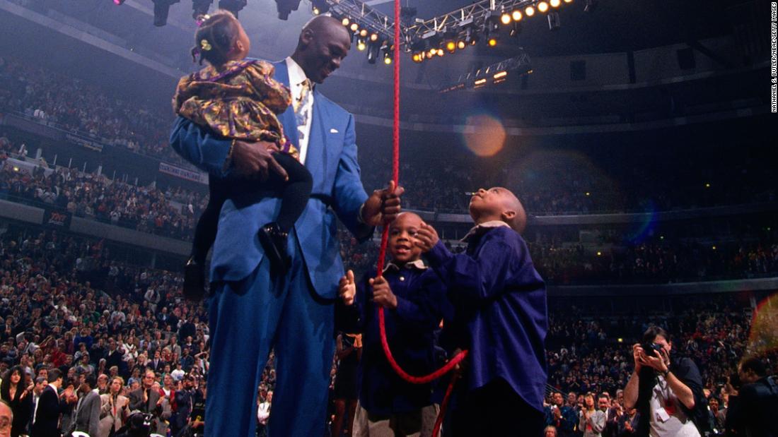 Jordan is joined by his children Jasmine, Marcus and Jeffrey as the Bulls retired his number in 1994.