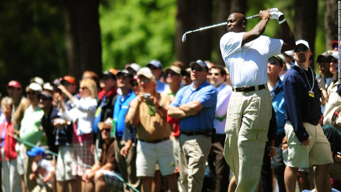 Jordan hits a golf shot while playing in a pro-am event in Charlotte, North Carolina, in 2010. A month earlier he bought the NBA&#39;s Charlotte franchise, becoming the second black majority owner of a major professional sports team.