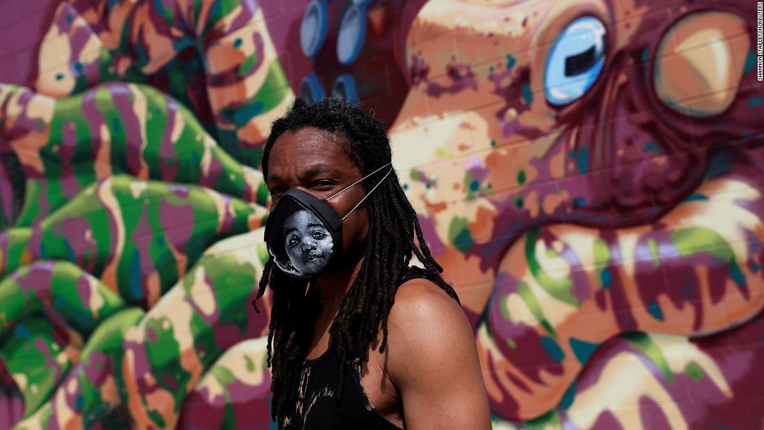 Orlando Baker wears a mask in Fort Collins, Colorado, that he developed using an image from the Notorious B.I.G.&#39;s album &quot;Ready to Die.&quot;  
