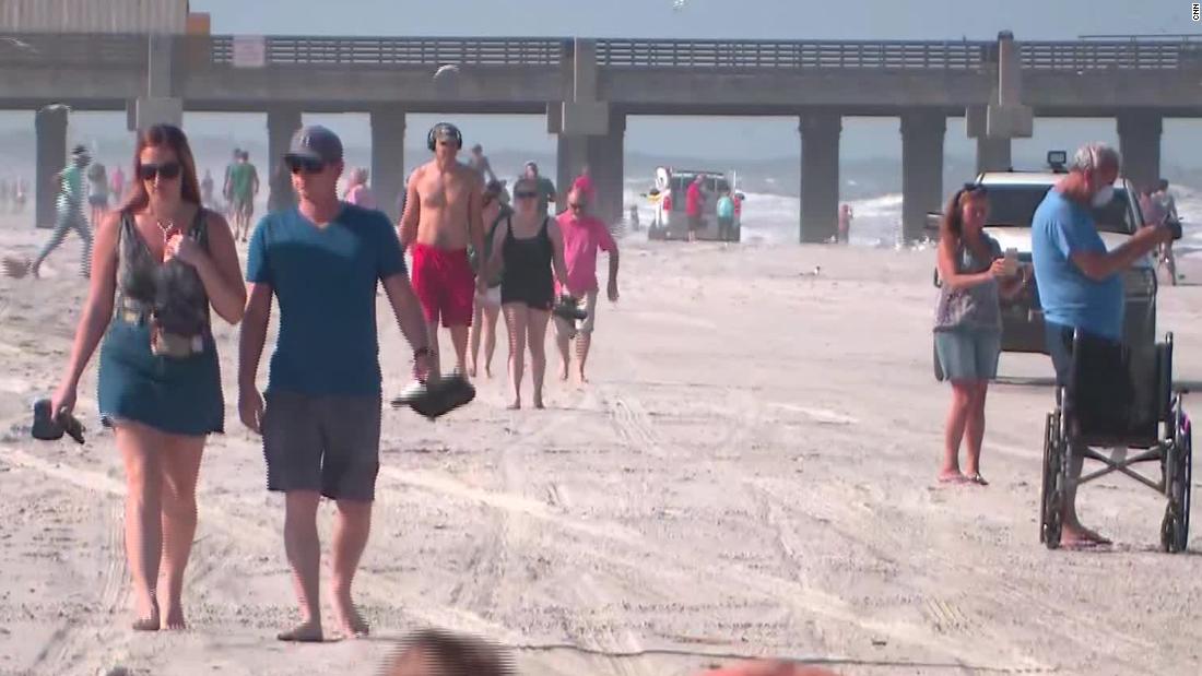 People Flock To Jacksonville Beaches As They Reopen Amid Coronavirus