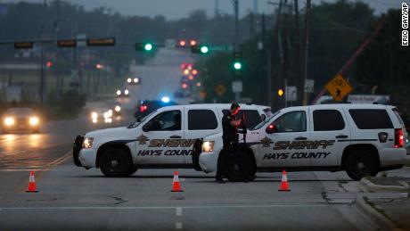 Police block off the scene after an officer was fatally shot in San Marcos, Texas.