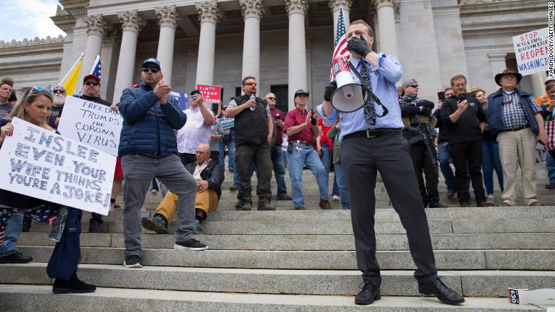 Gubernatorial candidate Tim Eyman speaks during a rally to protest Washinton state&#39;s stay-at-home order at the Capitol building Sunday in Olympia. 