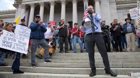 Gubernatorial candidate Tim Eyman speaks during a rally to protest Washinton state's stay-at-home order at the Capitol building Sunday in Olympia. 