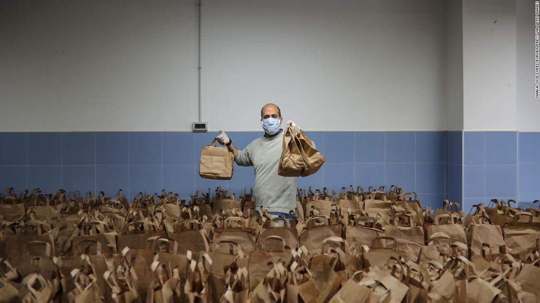 A member of the Don Bosco Foundation delivers food from the Fraternitas Project, which serves vulnerable families in Seville, Spain.