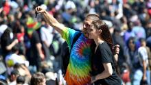 People take a selfie as thousands gather on Hippie Hill in San Francisco, Friday, April 20, 2018. Thousands of people flocked to Hippie Hill for the annual 420 celebration of all things pot and the number that is stoners&#39; code for smoking marijuana. Events also were held in other cities worldwide. (AP Photo/Josh Edelson)