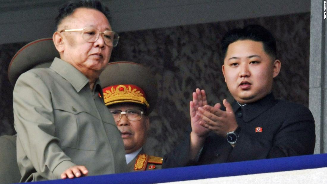 Kim attends a military parade alongside his father, left, in October 2010.