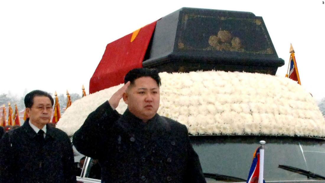 Kim salutes as a hearse carried his father&#39;s body in Pyongyang, North Korea, in December 2011. The state-run Korean Central News Agency reported that power had been transferred to Kim Jong Un at the behest of his father in October of that year.