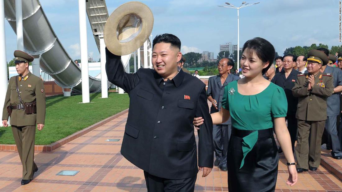 Kim is accompanied by his wife, Ri Sol Ju, at an event in Pyongyang in July 2012.