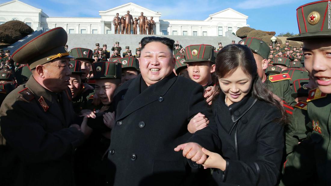 Kim and his wife visit a school in Pyongyang in March 2017.