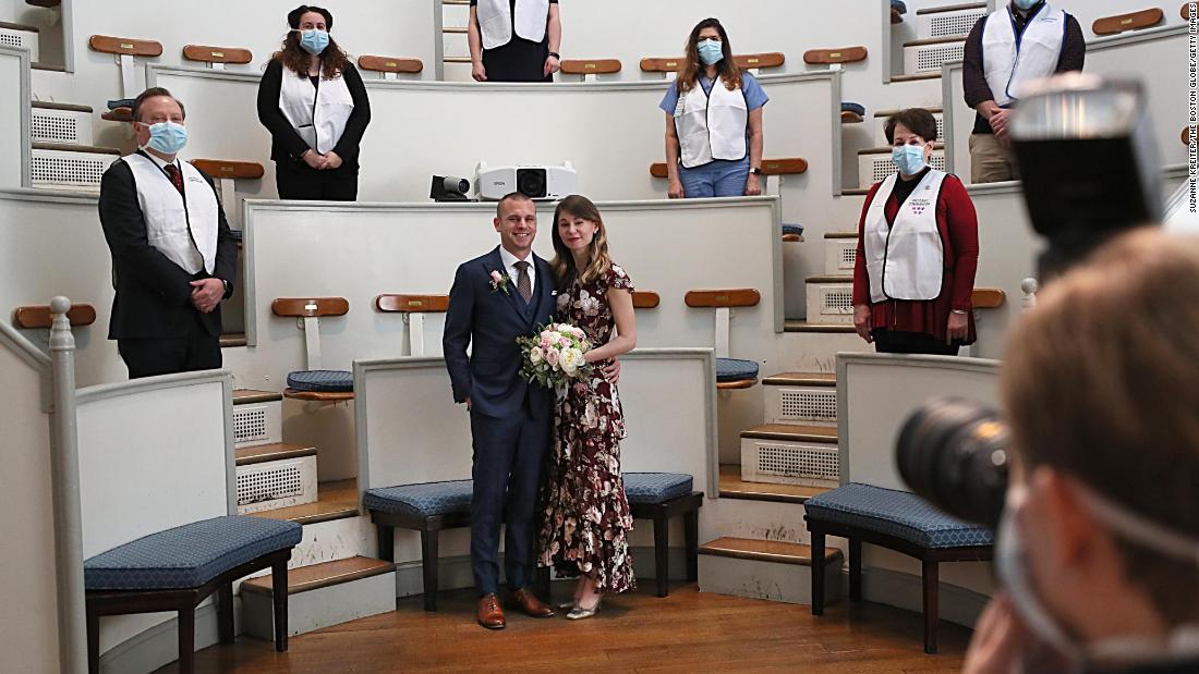 Matt Shearer and Jen Andonian get married at the Massachusetts General Hospital Ether Dome in Boston on March 27. They are both epidemiologists who work in the field of disaster management. Shearer and Andonian were supposed to get married on March 20 in Ann Arbor, Michigan. For their wedding at the MGH Ether Dome, which was once the hospital&#39;s operating room, the MGH General Store and Flower Shop did their flowers; Nutrition and Food Service made their cake; and the Photo Lab took the photos and the video to send to the couple&#39;s families.