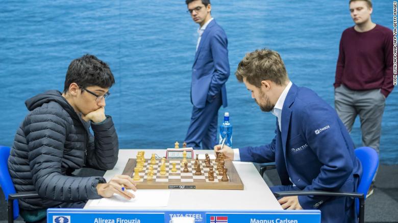 Firouzja (L) against Carlsen during the ninth round of the Tata Steel Chess Tournament in Wijk aan Zee, the Netherlands.