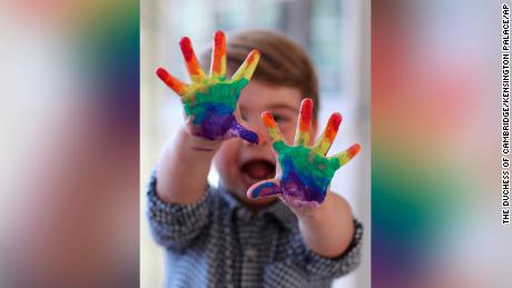 Prince Louis painted a rainbow in photos released to mark his second birthday.