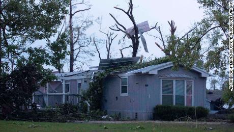 A damaged home is seen after an apparent tornado touched down Wednesday in Onalaska, Texas. 