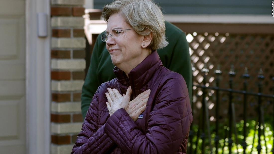 Warren acknowledges supporters as she arrives to speak to the media outside her home in Cambridge, Massachusetts, in March 2020. She had just dropped out of the presidential race.