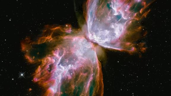 The Bug, or Butterfly Nebula looks like a butterfly with its wings stretching across the galaxy. It's actually a cloud of roiling gas shed by a dying star. Scientists say the gas is more than 36,000 degrees Fahrenheit and is expanding into space at more than 600,000 miles an hour. This image was taken with Hubble's Wide Field Camera 3, a camera installed on Hubble during its May 2009 upgrade by shuttle astronauts. The nebula is about 3,800 light years away in the constellation Scorpius.