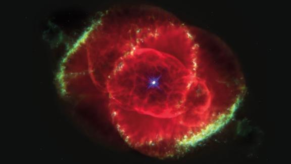 The Cat's Eye Nebula is a bunch of glowing gases kicked out into space by a dying star. This Hubble Space Telescope image shows details of structures including jets of high-speed gas and unusual knots of gas. This color picture is a composite of three images taken at different wavelengths. The nebula is estimated to be 1,000 years old. It's about 3,000 light years from Earth in the constellation Draco.
