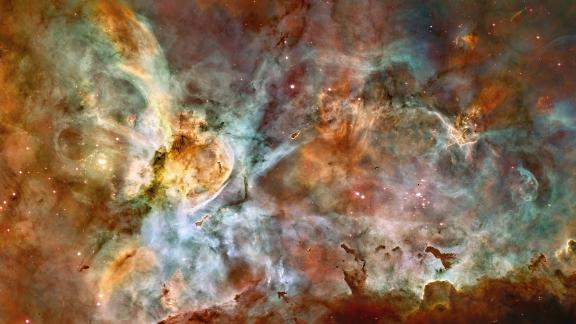 This huge nebula is 7,500 light years from Earth in the constellation Carina. It's one of the largest and brightest nebulas and is a nursery for new stars. It also has several stars estimated to be at least 50 to 100 times the mass of our Sun, including Eta Carinae, one of the brightest stars known and one of the most massive stars in the Milky Way Galaxy.
