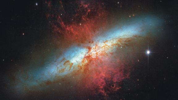 The Cigar Galaxy is 12 million light years away. It gets its name from its shape: From Earth it looks like an elongated elliptical disc.