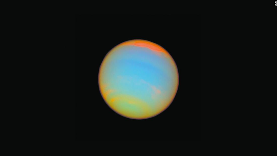Hubble captured this image of the distant blue-green world Neptune in 2005. Fourteen different colored filters were used to help scientists learn more about Neptune&#39;s atmosphere. Neptune is about 2.8 billion miles from Earth.