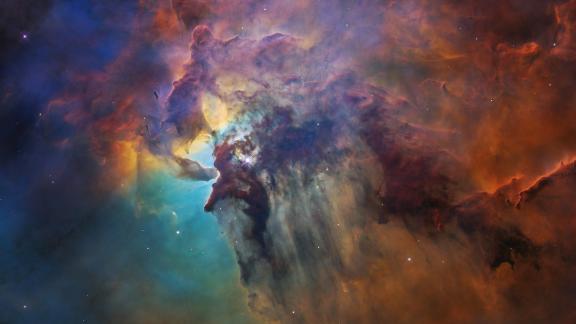 This 2018 Hubble image shows the Lagoon Nebula, a chaotic nursery full of baby stars. At the center of this image, a young star 200,000 times brighter than our sun blasts out ultraviolet radiation. 