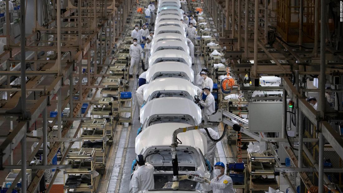 Workers assemble cars at a Dongfeng Honda factory in Wuhan on April 8, the day the city&#39;s unprecedented &lt;a href=&quot;https://www.cnn.com/interactive/2020/04/world/wuhan-coronavirus-cnnphotos/index.html&quot; target=&quot;_blank&quot;&gt;76-day lockdown&lt;/a&gt; was lifted.