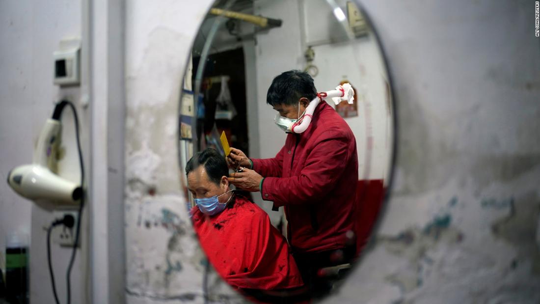 Barber Yang Guangyu cuts a client&#39;s hair in Wuhan, China, on April 11 while wearing protective gear assembled from a water bottle, mask and plastic pipe. The first city in the world to go into lockdown — and the epicenter of the global coronavirus outbreak — is &lt;a href=&quot;https://www.cnn.com/interactive/2020/04/world/wuhan-coronavirus-cnnphotos/index.html&quot; target=&quot;_blank&quot;&gt;slowly returning to normal.&lt;/a&gt;