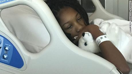 Alyssa clutches a stuffed animal in Inova Fairfax Children&#39;s Hospital during one of her stays.