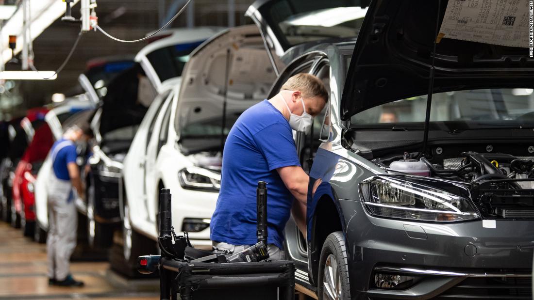 An employee works on the production line at a &lt;a href=&quot;https://edition.cnn.com/2020/04/27/business/volkswagen-restart-production-wolfsburg/index.html&quot; target=&quot;_blank&quot;&gt;reopened Volkswagen plant&lt;/a&gt; in Wolfsburg, Germany, on April 27. The world&#39;s largest carmaker has made 100 changes to the way its plants operate as it tries to restart business without risking the health of hundreds of thousands of workers.