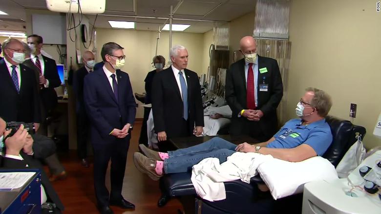 Pence tours clinic without a mask despite policy 