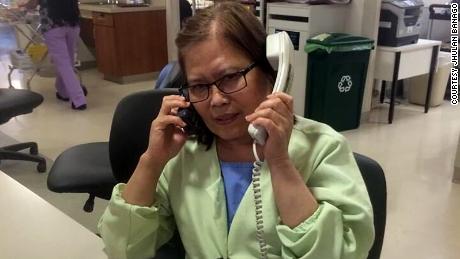 Jhulan Banago says this photo of his mom, Celia Yap-Banago, always makes him laugh. &quot;I think it encompasses mom -- hardworking and joking. No one answers two phones and has two conversations at once. ... It's nice to see that mom was so happy at work.&quot;
