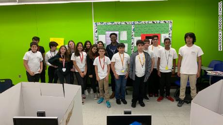 An IT team of middle school students is easing the transition to online learning for teachers