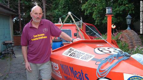 Walters poses with his boat before setting off to break the record.