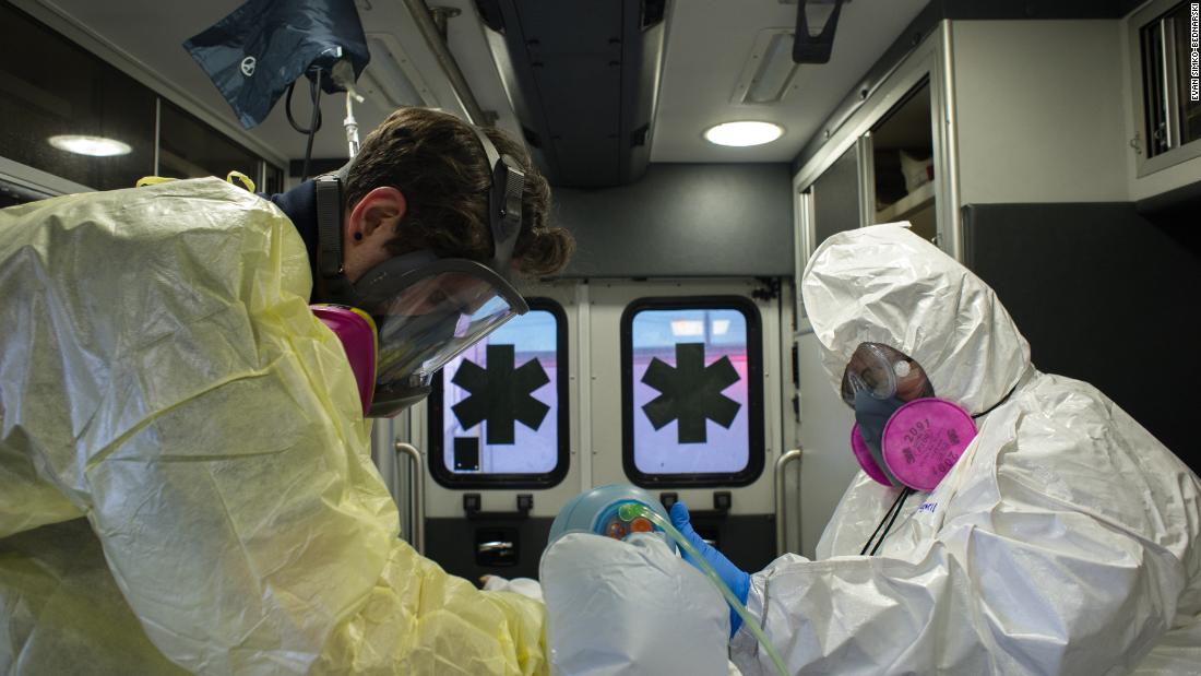 Storzillo works on an intubated patient while Nicole Tugwell, an EMT on loan from Baltimore, keeps the patient breathing.
