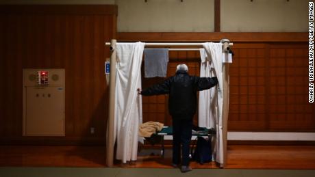 Katsuya Asao, 54, prepares to rest at a shelter provided by Kanagawa prefecture for those who used to stay at internet cafes, which were asked to close due to the COVID-19 coronavirus outbreak state of emergency.