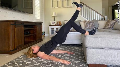 Dana Santas gets off her couch and demonstrates the single-leg variation on the elevated hip bridge, one of the exercises in this total-body routine that you can do if you&#39;re self-isolating at home.